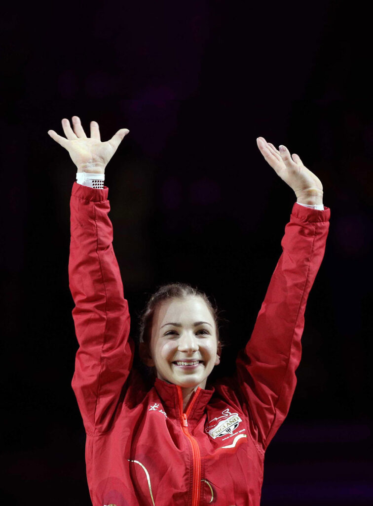 Kelly Simm waving at competition